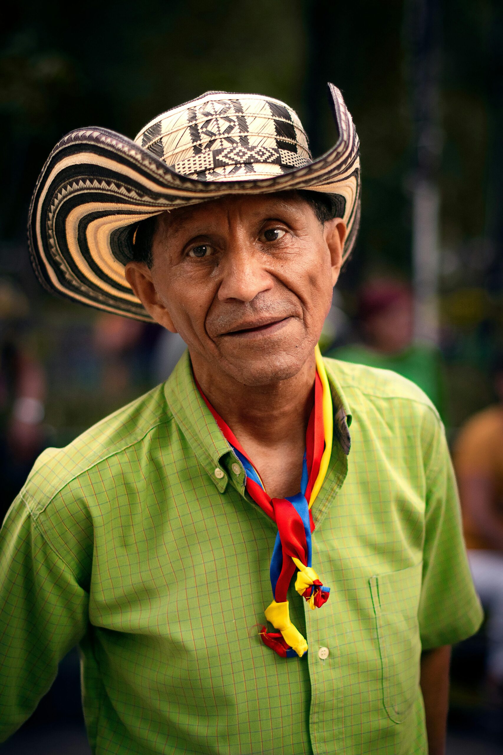 Portrait of a man in traditional attire at a festival in Ciudad de México, vibrant and cultural.